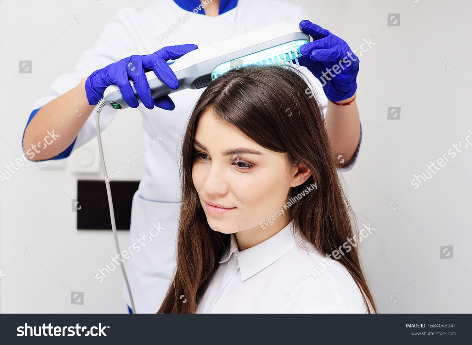 stock-photo-doctor-cosmetologist-dermatologist-treats-the-skin-of-the-patient-s-head-a-young-pretty-woman-1684043941